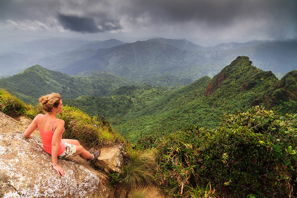 Adventurous young woman on top of the beautiful jungle of the El